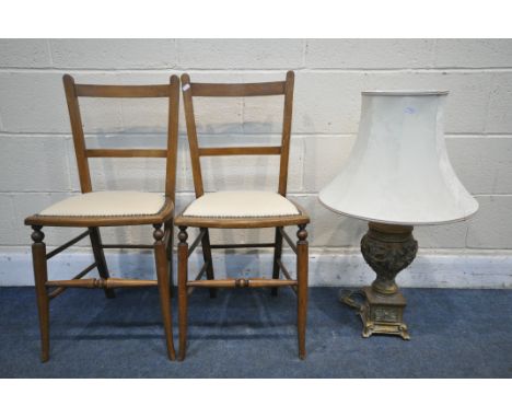 A MODERN GILT TABLE LAMP, with foliate decoration, and a fabric shade, along with two chairs (condition report:-surface scrat