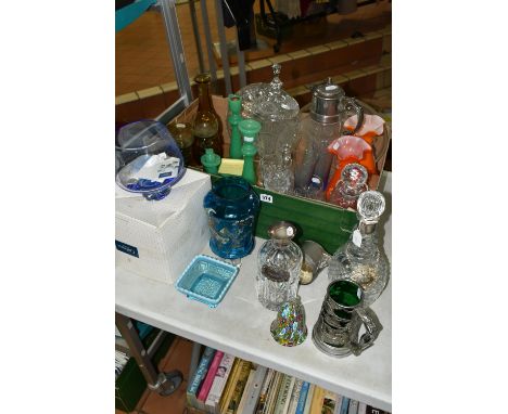 A BOX AND LOOSE COLOURED AND DECORATIVE GLASS WARES, to include a decanter with silver mount, hallmarked London 1972, two sil