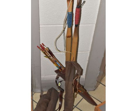 A SET OF JAQUES ARCHERY BOWS AND ARROWS, comprising a 20lb 5ft bow,  an 18lbs 5ft bow in a canvas bag, and a faux leather qui