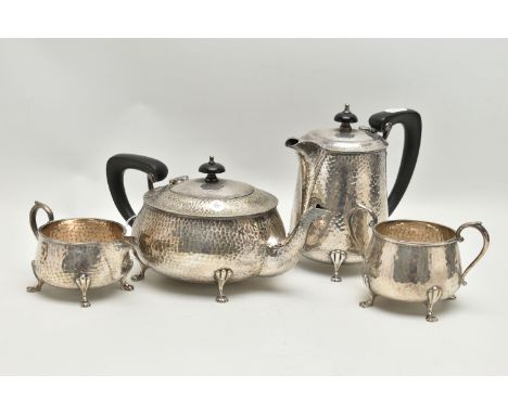 A FOUR PIECE TEA SERVICE SET, EPNS hammer effect set comprising of a teapot, coffee pot, milk jug and sugar bowl, each rasied