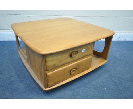 AN ERCOL ELM PANDORA'S BOX OCCASIONAL TABLE, model 735, with two drawers, and shelving, on casters, 80cm squared x height 40c