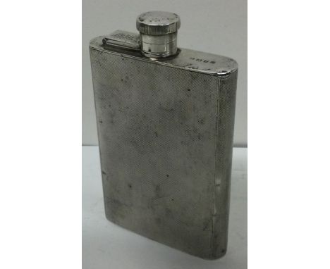 A large engine turned silver flask. Birmingham 1920. Approx. 151 grams. Est. £200 - £400.