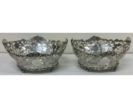 A large pair of silver pierced baskets. London 1909. By Charles Stuart Harris. Approx. 392 grams. Est. £300 - £500.