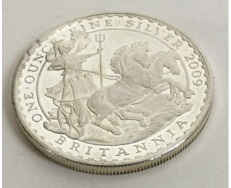 A one ounce Britannia silver coin. Approx. 31 grams. Est. £30 - £50.