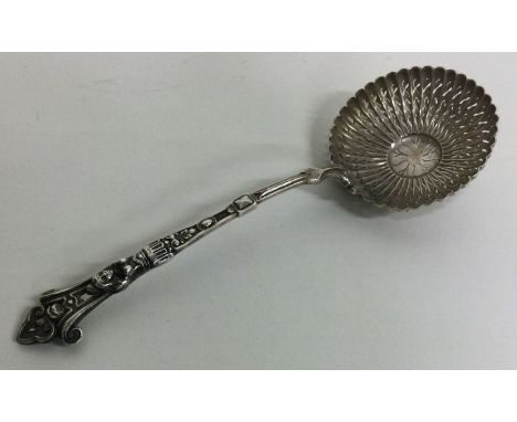 A French silver sifter spoon with figural terminal. Approx. 67 grams. Est. £80 - £120.