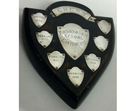 A large silver and wooden chess prize presentation plaque. Approx. 274 gross grams. Est. £50 - £70.