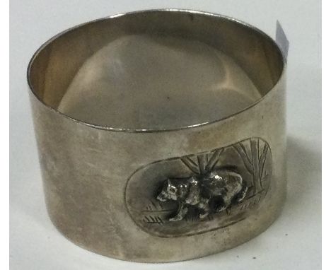 A novelty silver napkin ring embossed with bear decoration. Sheffield 1949. By Mappin and Webb. Approx. 28 grams. Est. £50 - 