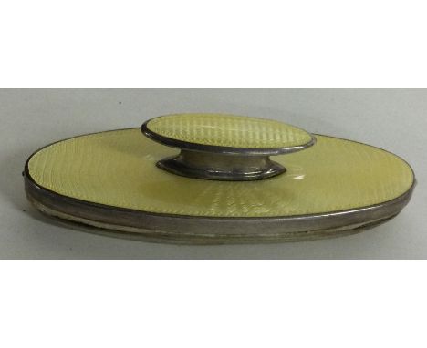 A silver and yellow enamel nail buffer. Birmingham 1937. By Adie Brothers. Approx. 44 grams. Est. £60 - £80.