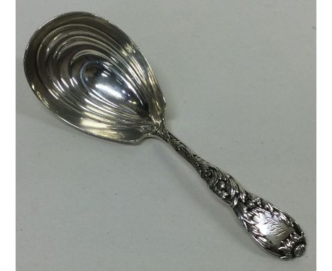 TIFFANY &amp; CO: A silver caddy spoon. Approx. 31 grams. Est. £150 - £200.