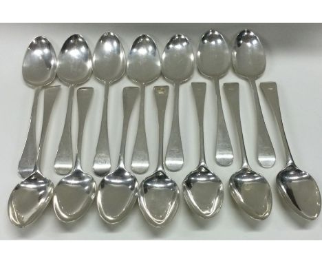 A good set of fourteen OE pattern silver dessert forks with crested decoration. London. Approx. 488 grams. Est. £250 - £300.