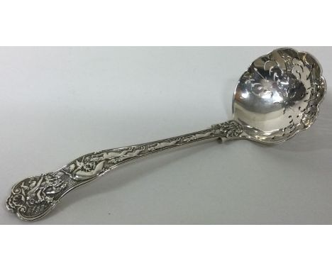 A Victorian stag hunt pattern silver sifter ladle. London 1899. Approx. 134 grams. Est. £120 - £150.