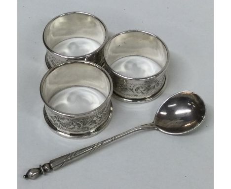 A set of three silver napkin rings etc. Approx. 59 grams. Est. £20 - £30.