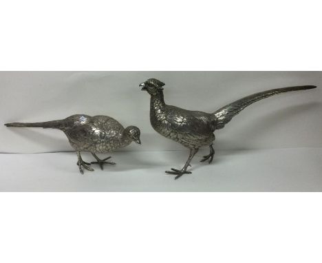 A large pair of silver pheasants. Marked to feet. Approx. 1221 grams. Est. £2500 - £3000.