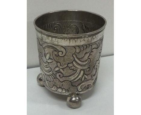 A 17th Century Russian silver beaker with chased decorations. 1757. Approx. 80 grams. Est. £500&nbsp;- £800.