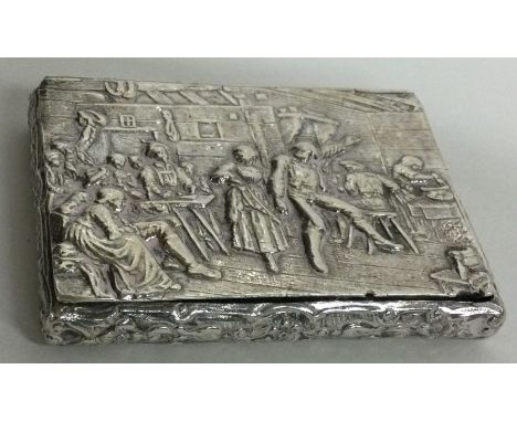 A chased Victorian silver snuff box with hinged lid embossed with tavern scene, bearing import marks. Approx. 109 grams. Est.