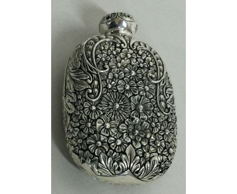 A chased silver flask with screw top lid of Chinese design. Approx. 88 grams. Est. £60 - £80.