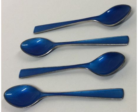 A set of four silver and enamelled spoons. Possibly Norwegian? Approx. 60 grams. Est. £120 - £150.