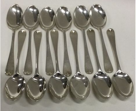 A set of twelve OE pattern silver teaspoons. Approx. 136 grams. Est. £40 - £60.