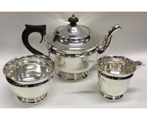 A silver three piece tea service. Sheffield. Approx. 662 grams. Est. £150 - £250.