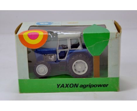 Yaxon 1/43 Ford Type Tractor. Missing decals otherwise VG in Box.