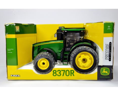 Ertl 1/16 Farm Diecast model comprising John Deere 8370R Tractor. NM to M in Box.