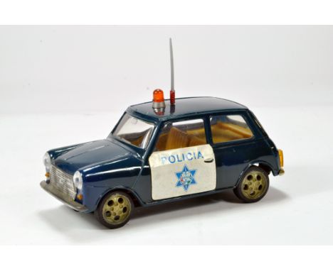 An approx 1/20 scale model of a Mini with Policia livery. Friction driven with roof beacon and aerial. Displays well hence G 