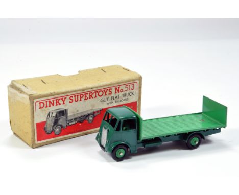 Dinky No. 513 Guy Flat Truck with Tailboard  with 1st type cab, dark green cab and chassis. Light Green Back. Generally VG to