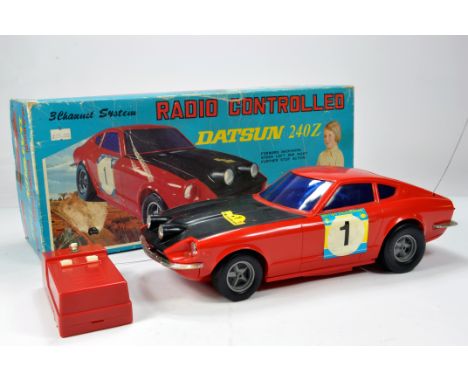 Asahi (Japan) large scale plastic 3 Channel System Radio Controlled Datsun 240Z. Untested but displays well hence E in Box.