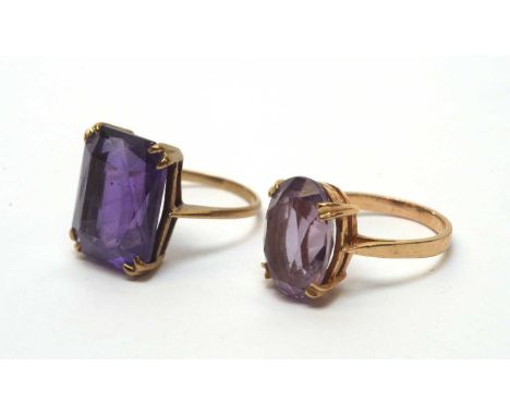 Two amethyst rings, one amethyst oval the other rectangular, one on 9ct gold shank, the other stamped 9ct, both ring size K.