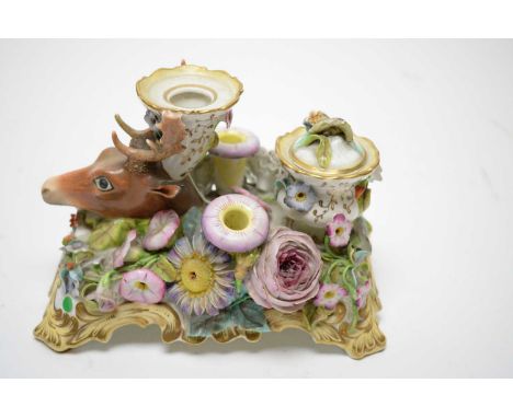A mid 19th Century English pen and inkstand, possibly Rockingham, decorated in the form of a stag's head, on floral decorated