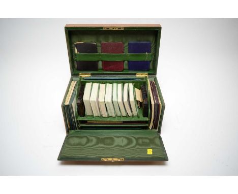 An early 20th Century fine leather card games box by Charles Goodall &amp; son Ltd, London, including decks of playing cards,