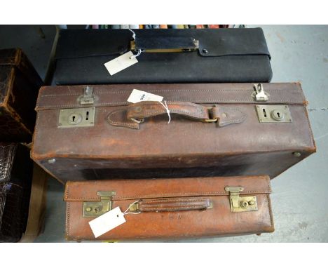 Two vintage travel trunks, each monogrammed with initials 'T.H.N.', the larger 60.5cms wide; together with another vintage tr