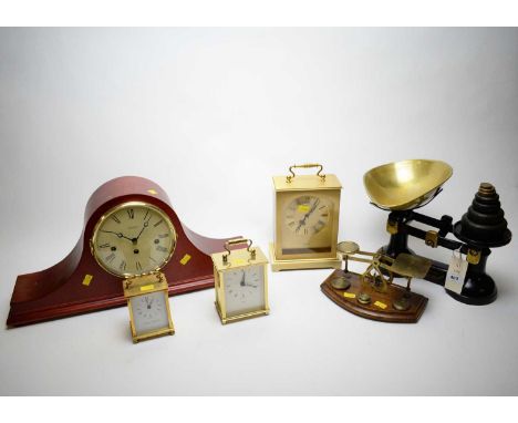 A black-painted 'The Viking' weighing scales, by S.J. Thornton &amp; Co., with weights and brass pan; four clocks; and a set 