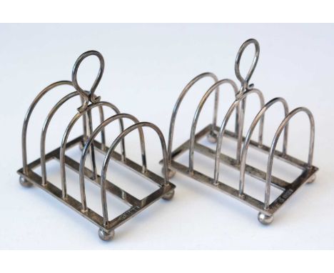 A pair of silver five bar toast racks, by William Hutton &amp; Sons Ltd., Sheffield 1913, of plain form, 8cms long, 6.2oz. gr