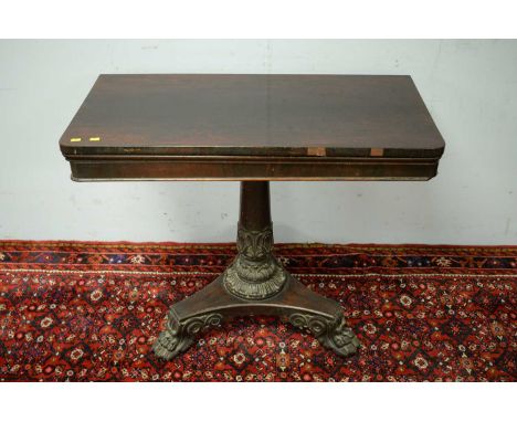 A William IV card table, the hinged rectangular top enclosing a baize-lined playing surface, raised on a central tapering aca