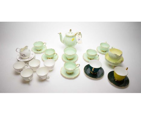 A Paragon green and gilt coffee service; a Foley bone china cream jug and sugar bowl; a 'Moon Rose' coffee cup, saucers and j