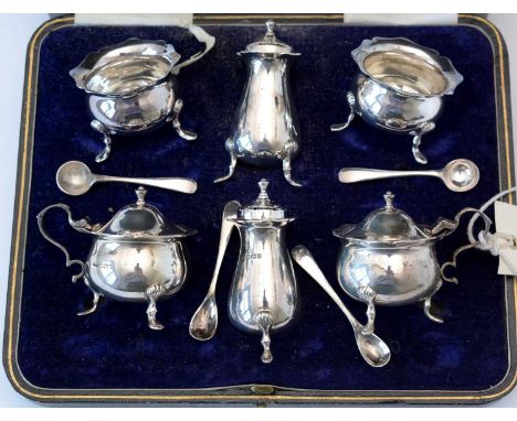 A six-piece silver condiment set, by Henry Wilkinson, Sheffield 1915, of cauldron and baluster form with wavy rim, including 