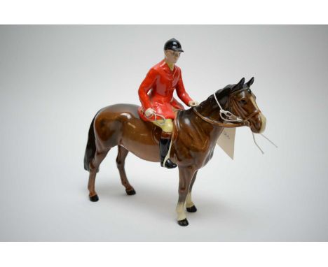 A Beswick model of a huntsman on Bay Horse standing on all fours, 21cms high.