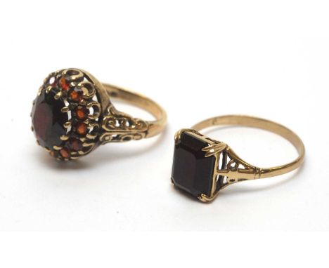 A garnet cluster ring, on 9ct yellow gold shank, ring size L; together with a res-paste stone ring, the yellow metal shank st