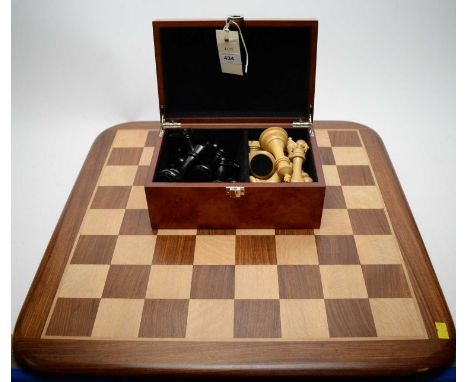 A fine Staunton pattern chess set, unnamed, each piece weighted, King 10.5cms high, with inlaid chess board.