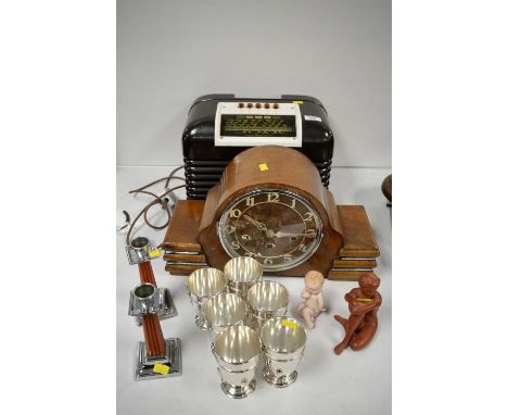 A bakelite cased Bush radio; a walnut cased Art Deco mantel clock with chiming movement; a set of six EPNS Art Deco tumbler c