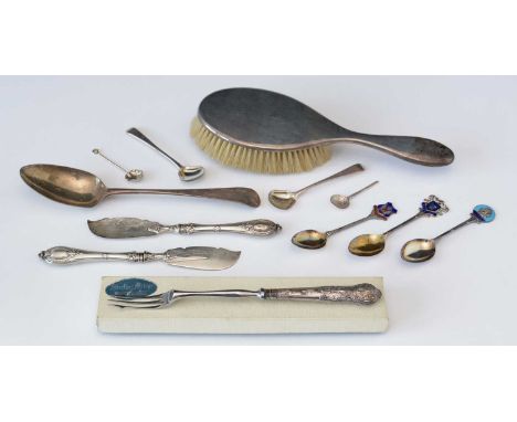 A selection of silver, to include: a silver-backed hand brush; a pickle fork with King's pattern silver-filled handle; spoons