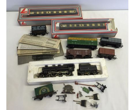 A part boxed Mainline OO gauge 756006 locomotive and tender together with 2 boxed Lima coaches, 6 unboxed wagons and assorted