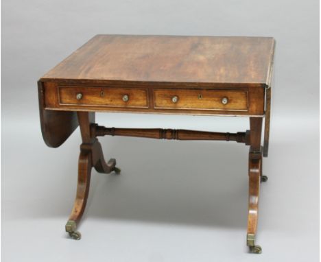 REGENCY MAHOGANY SOFA TABLE, the rounded top above two true and two false drawers on sabre legs, height 69cm, max width 141cm