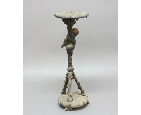 BLACKAMOOR STAND, earlier 19th century, carved as a boy climbing a tripod tree, height 90cm