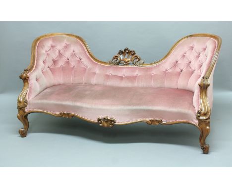 VICTORIAN ROSEWOOD SOFA, a central scrolling crest flanked by two buttoned spoon backs, serpentine seat, scrolling arms and c