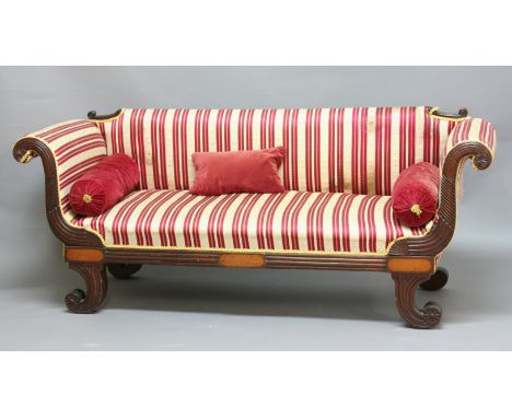 REGENCY MAHOGANY SOFA, with a padded back, scrolling arms and stuffed over seat, the frame with reeded scrolling, height 80cm