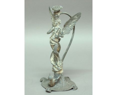 ART NOUVEAU CENTREPIECE, modelled as a male angel playing a lyre with scrolling supports behind, a child at the foot, height 