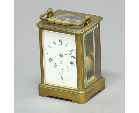 FRENCH BRASS FOUR PANE CARRIAGE CLOCK, by Drocourt, the enamelled dial with black Roman numerals above a subsidiary alarm dia