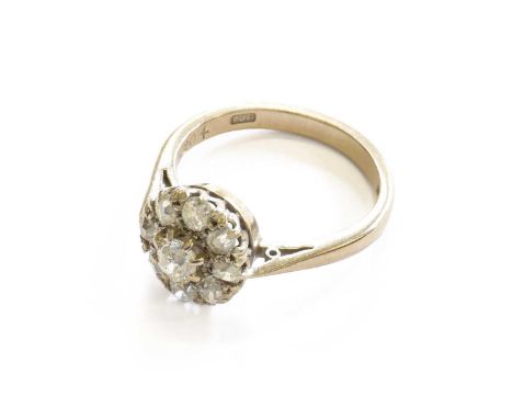 An 18 Carat White Gold Diamond Cluster Ring, finger size NThe ring is in good condition, with slight chips and nibbles throug